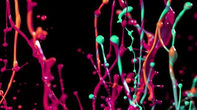 Colorful splashing paint in super slow motion. Shot with high speed cinema camera, 1000fps