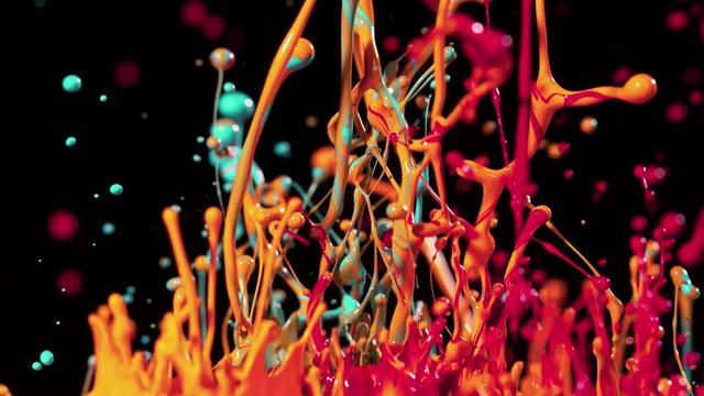 Colorful splashing paint in super slow motion. Shot with high speed cinema camera, 1000fps