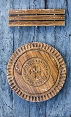 wooden sign with emblem, Kazakh pattern