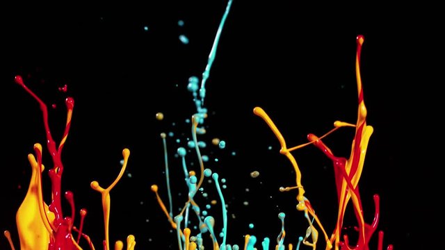Colorful splashing paint in super slow motion. Shot with high speed cinema camera, 1000fps