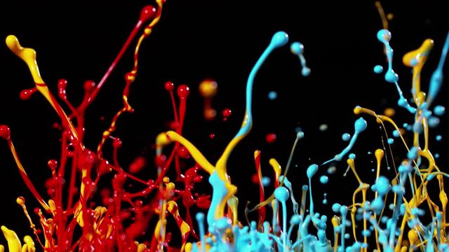Colorful splashing paint in super slow motion. Shot with high speed cinema camera, 1000fps