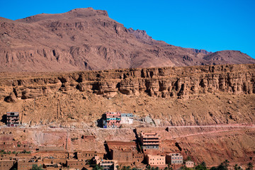 Landscape view of Atlas mountains and houses in Todra gorge in Tinghir, Morocco