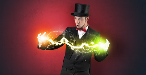 Magician sparkling super power between his two hands