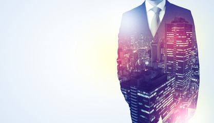  Young businessman standing and thinking with night city background