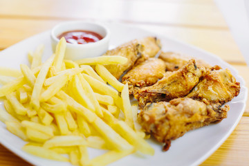 Fried chicken with french fries on the table
