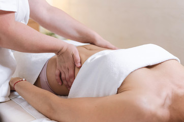 Fototapeta na wymiar abdomen massage at beauty salon