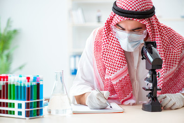 Arab chemist working in the lab office