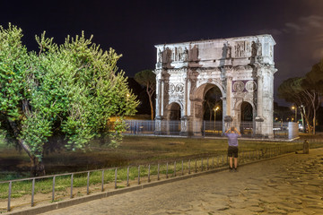 Antique arch of Constantine in Rome at night, Italy
