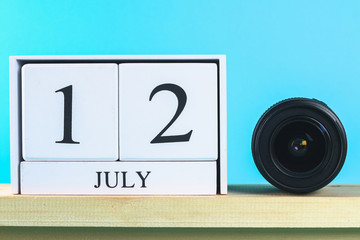 The concept of the photographer's day and the day of photography on a blue pastel background.