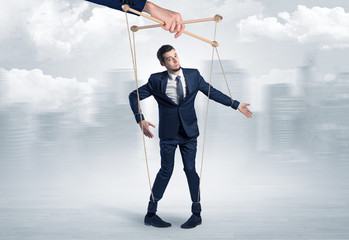 Puppet man with big city great power concept
