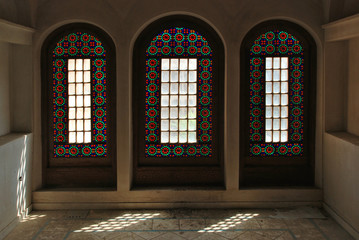 Fototapeta na wymiar Stained glass window inside a traditional mansion in Kashan, Iran