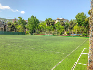 TBILISI, GEORGIA -  - MAY 17, 2018:  Football stadium between residential buildings. Springtime in city.