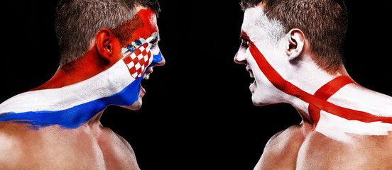 Soccer or football fan athlete with bodyart on face - flags of Croatia vs England. Sport Concept with copyspace. © Mike Orlov