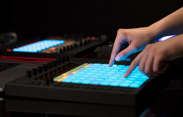 Fototapeta premium Dj hand remixing music on midi controller 