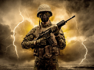 Armed soldier standing in rainy obscure weather
