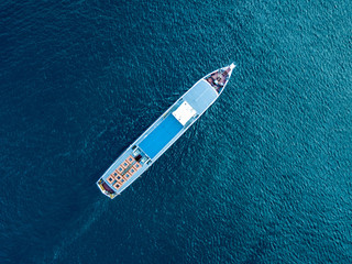 directly above top view of summer cruise trip ferry ship isolated on water surface