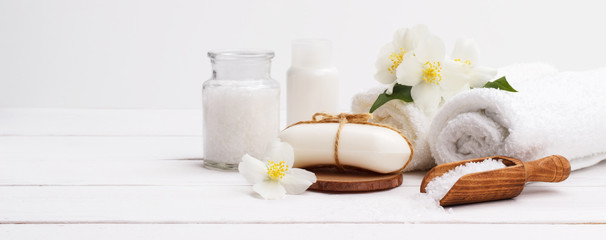 Spa setting and health care items,jasmin aromatic soap,body oil,bath salt,milk,massage stones and...