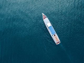 directly above top view of summer cruise trip ferry ship isolated on water surface