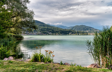 Fototapeta na wymiar Landscape of Lake Lugano in Lavena Ponte Tresa, province of Varese, Italy