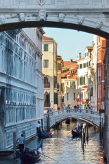 Fototapeta na wymiar Traditional gondola on a canal in Venice, Italy.
