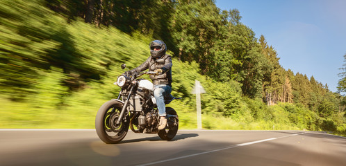 motorbike on the road riding. having fun riding the empty road on a motorcycle tour / journey