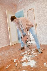 Man demolishing a floor