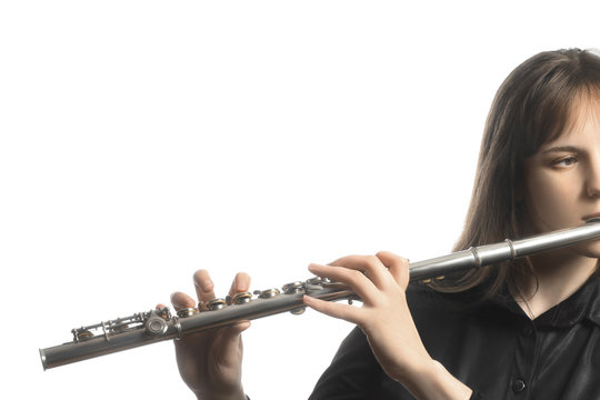 Flutist playing flute instrument.