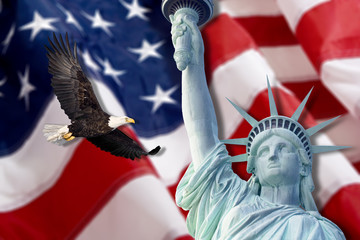Fototapeta premium Bald eagle and Statue of liberty with american flag out of focus