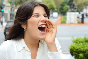 Young woman shouting and screaming.