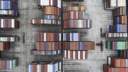 aerial view of loading and moving containers on container yard