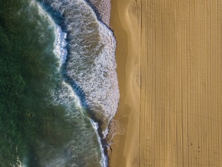 Lines etched in the sand at sunrise Redhead Beach, Newcastle, Australia - 212404578