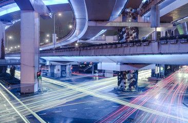 Night scene of asphalt road and modern bridge