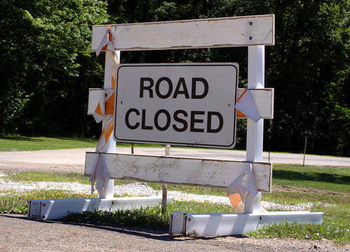 Old road closed sign