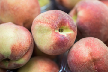 Fototapeta na wymiar New harvest peaches for sale at city farmers market