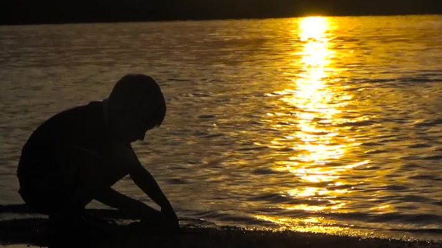 Child playing on the shore