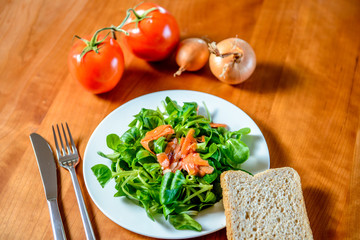 field salad with carrot, tomato, onion and bread