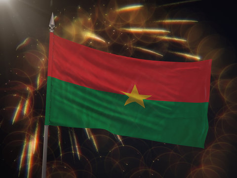 Flag of Burkina Faso with fireworks display in the background