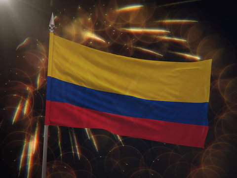 Flag of Colombia with fireworks display in the background
