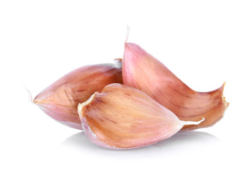 Garlic cloves on white background