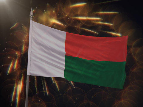 Flag of Madagascar with fireworks display in the background