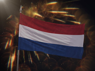 Flag of the Netherlands with fireworks display in the background