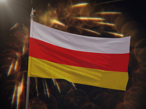Flag of South Ossetia with fireworks display in the background