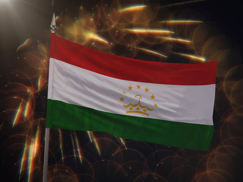 Flag of Tajikistan with fireworks display in the background