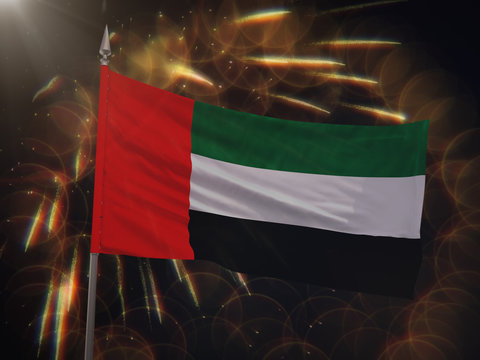 Flag of the United Arab Emirates with fireworks display in the background