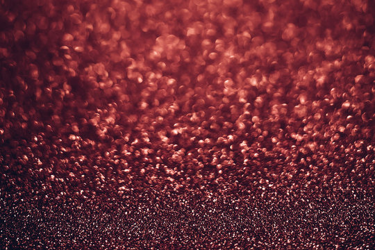 Background texture image of a flickering trendy red pear color surface