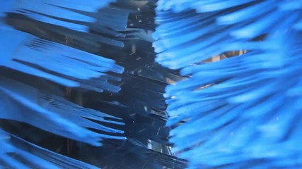 driving through blue spinning car wash