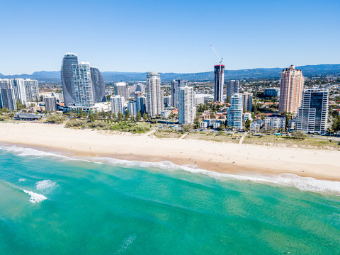 An aerial view for the Broadbeach skyline on the Gold Coast in Queensland with blue water