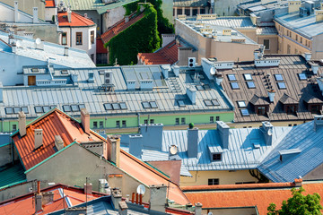 in the sunny day of the roof of the houses of the European city view from above