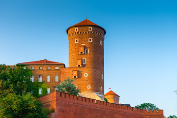 Krakow, Poland - August 11, 2017: high brick tower - Wawel castle in the suumer day against the blue sky
