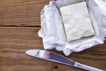 butter block on wooden board. Baking or cooking concept